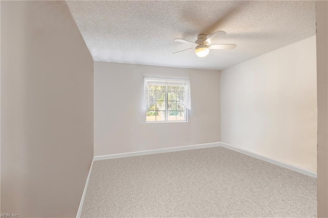 empty room featuring carpet, a textured ceiling, and ceiling fan