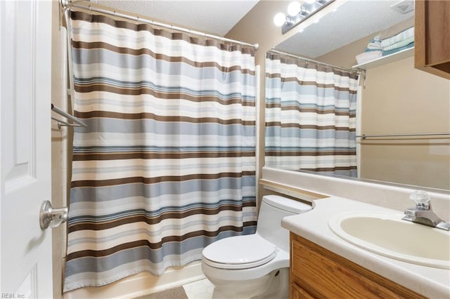 bathroom featuring vanity, tile patterned flooring, toilet, and walk in shower