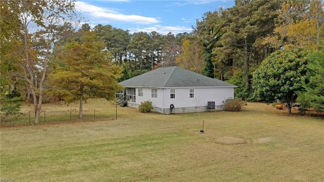 view of home's exterior featuring a yard and central air condition unit