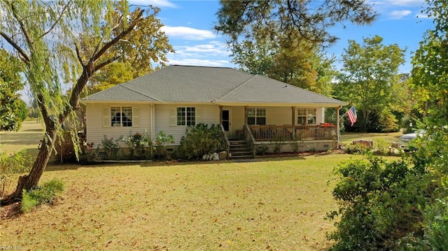 back of property featuring a lawn