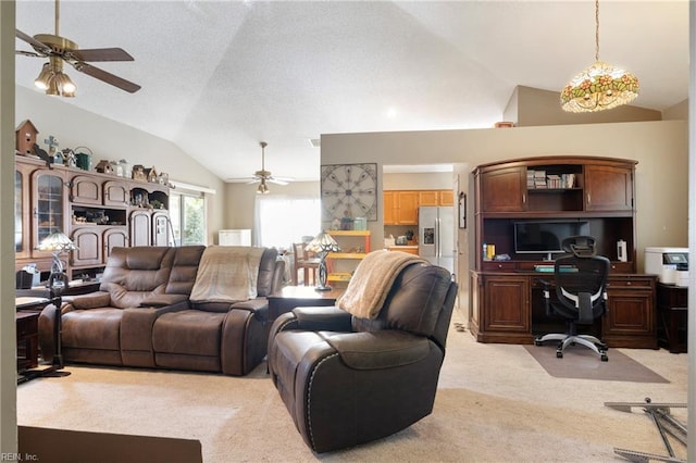 carpeted living room featuring ceiling fan and vaulted ceiling