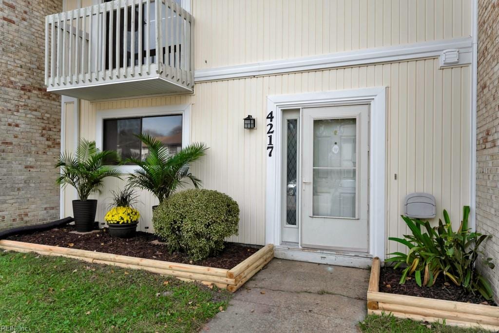 doorway to property with a balcony