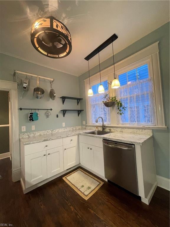 kitchen featuring white cabinetry, sink, dark hardwood / wood-style flooring, stainless steel dishwasher, and pendant lighting