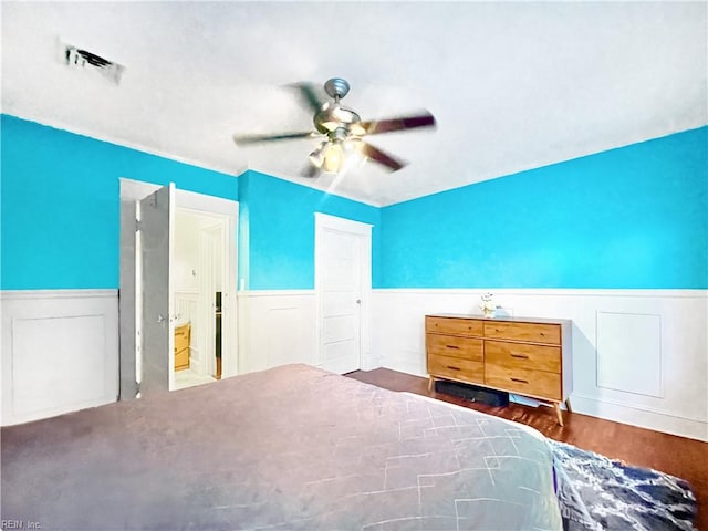 unfurnished bedroom featuring ceiling fan and dark hardwood / wood-style floors