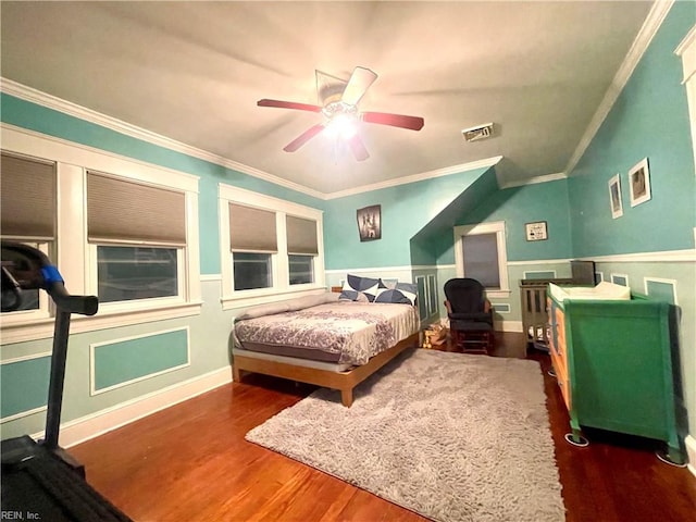 bedroom with ceiling fan, dark hardwood / wood-style floors, and ornamental molding