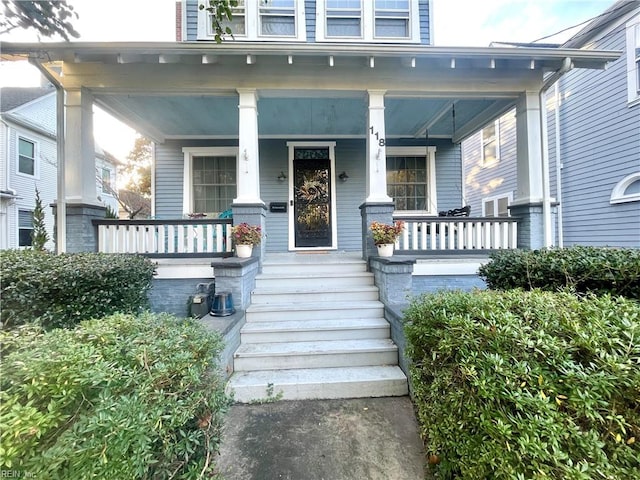 entrance to property with covered porch