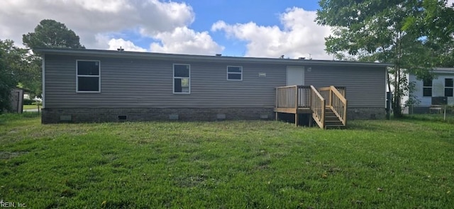 back of house with a lawn