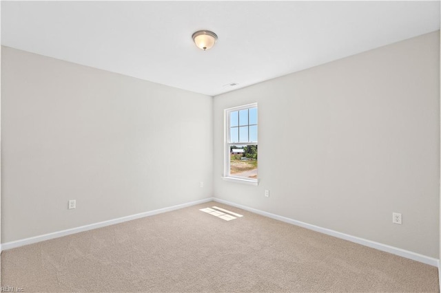 unfurnished room featuring carpet floors