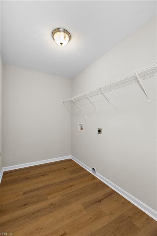 laundry room featuring hookup for a washing machine, wood-type flooring, and electric dryer hookup