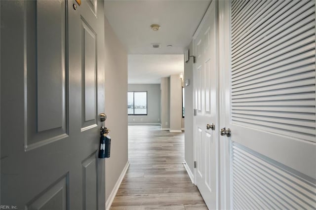 hallway featuring light hardwood / wood-style floors