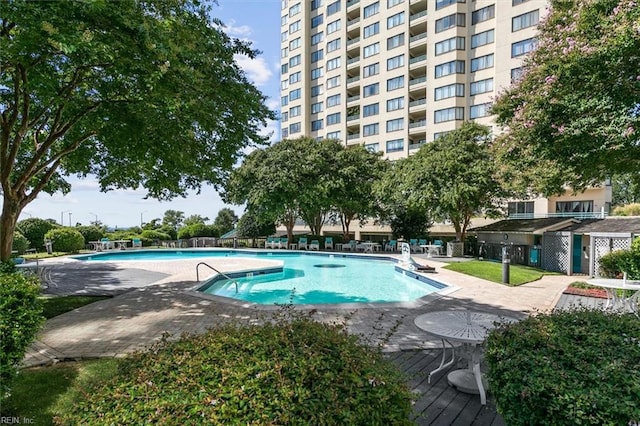 view of swimming pool with a patio area