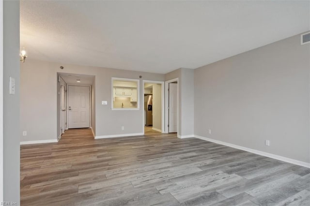 empty room featuring light hardwood / wood-style floors