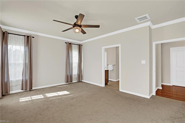 unfurnished bedroom featuring ornamental molding, light carpet, and ceiling fan