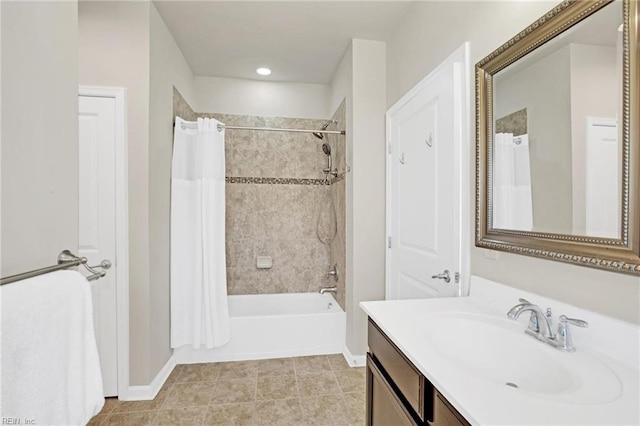 bathroom featuring vanity, shower / bath combination with curtain, and tile patterned floors