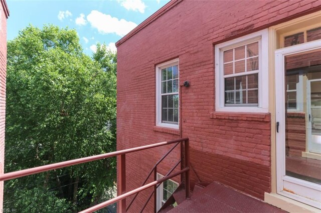 view of property exterior with a balcony