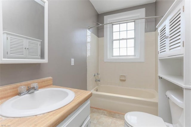 full bathroom featuring vanity, toilet, shower / bath combination, and tile patterned floors