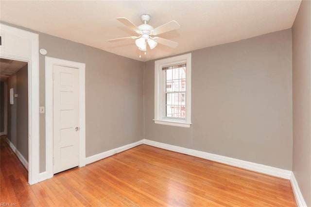 unfurnished room featuring light wood-type flooring and ceiling fan