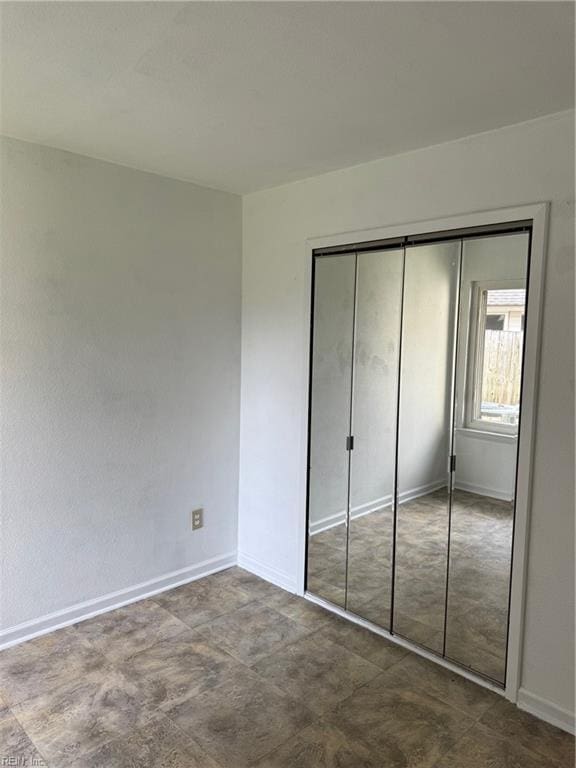 unfurnished bedroom featuring a closet