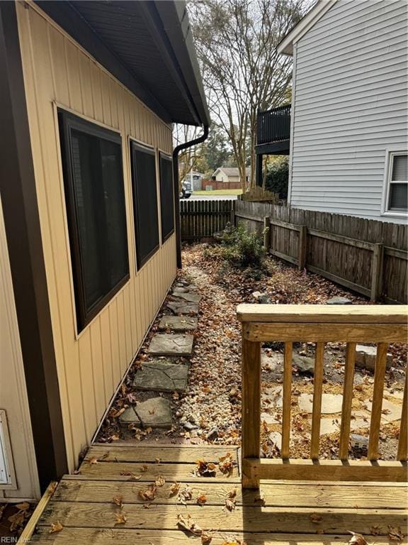 view of side of home featuring a wooden deck