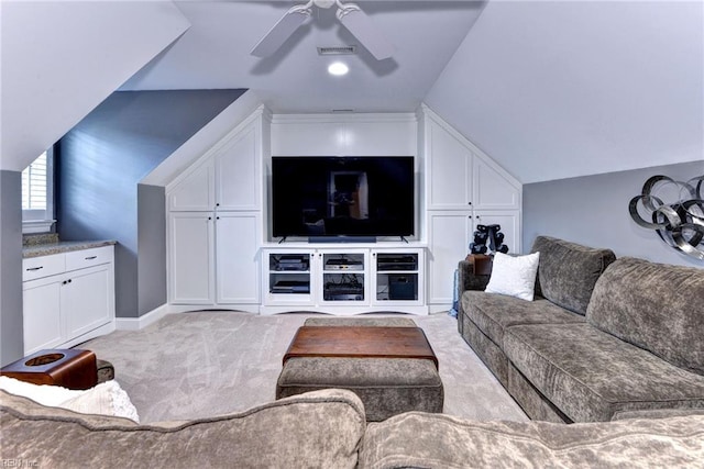 living room featuring lofted ceiling, ceiling fan, and light carpet