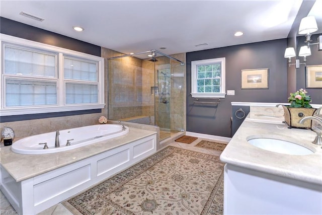 bathroom with vanity, plus walk in shower, and tile patterned floors