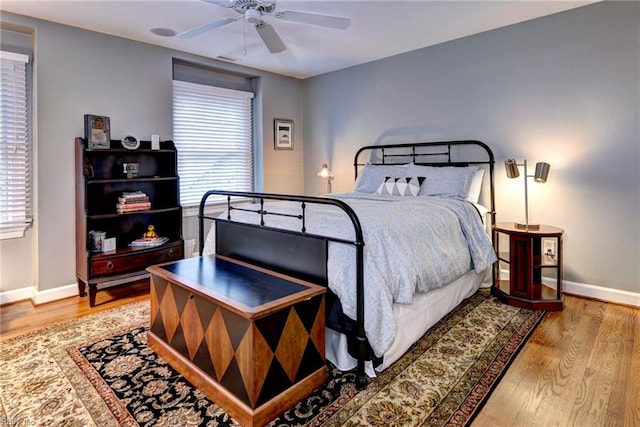 bedroom featuring ceiling fan and wood-type flooring