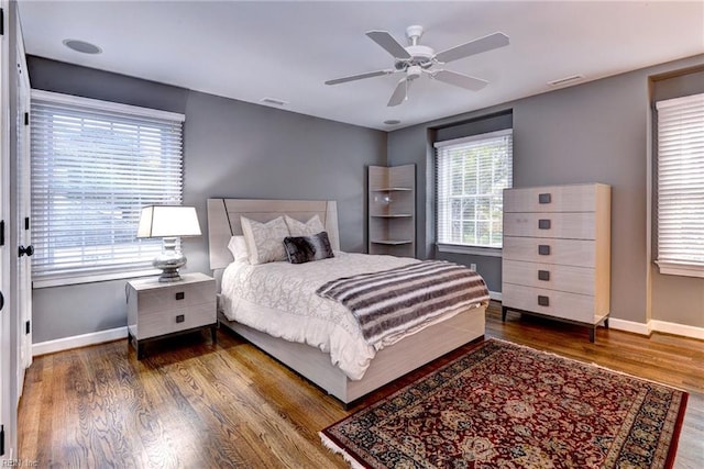 bedroom with hardwood / wood-style floors and ceiling fan