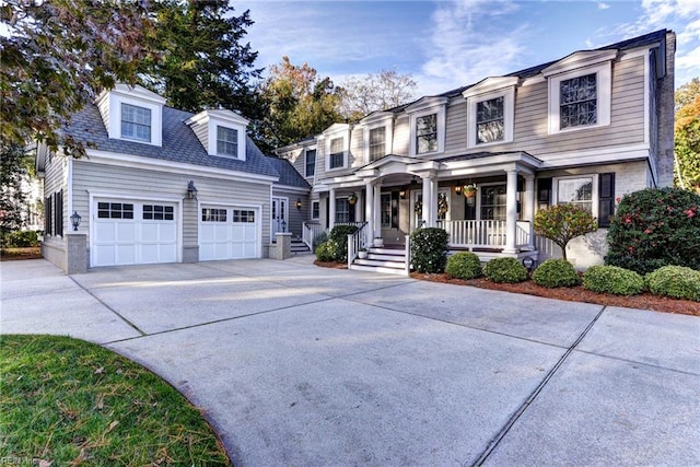 view of front facade with a garage and a porch