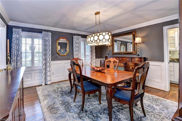 dining room featuring dark hardwood / wood-style floors and crown molding