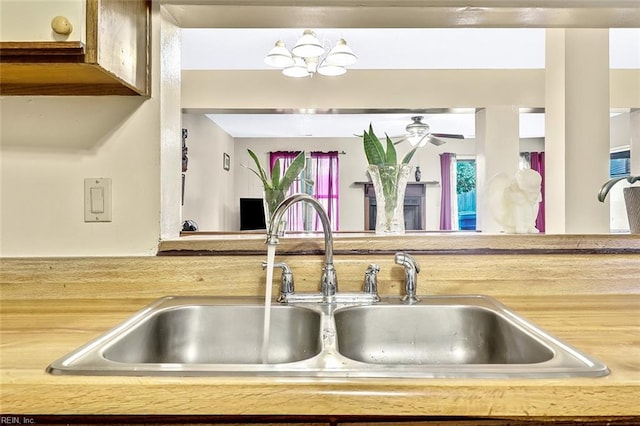 kitchen featuring a notable chandelier and sink