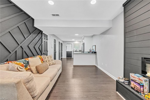 living room featuring dark hardwood / wood-style flooring