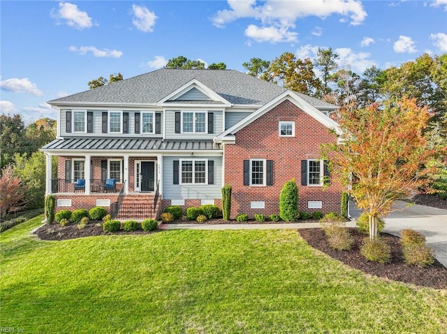 view of front of home featuring a porch and a front lawn