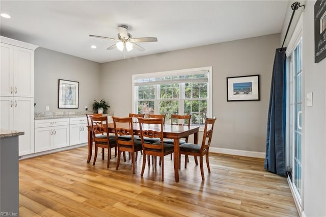 dining space featuring light hardwood / wood-style floors and ceiling fan