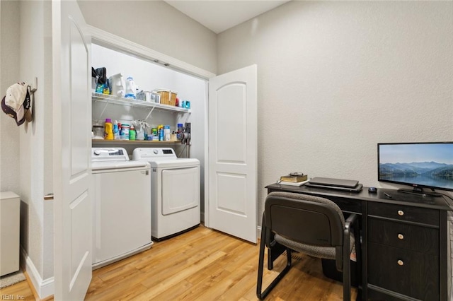 washroom featuring light wood-type flooring and washing machine and clothes dryer