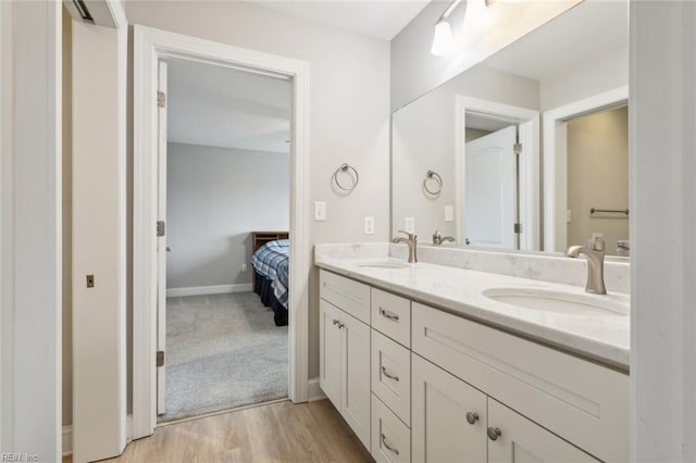 bathroom featuring hardwood / wood-style floors and vanity