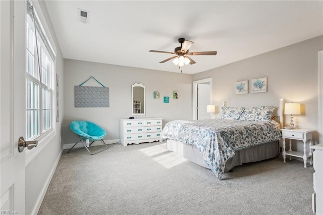 bedroom with ceiling fan and carpet floors