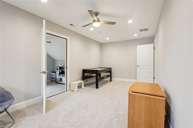 misc room with carpet and ceiling fan