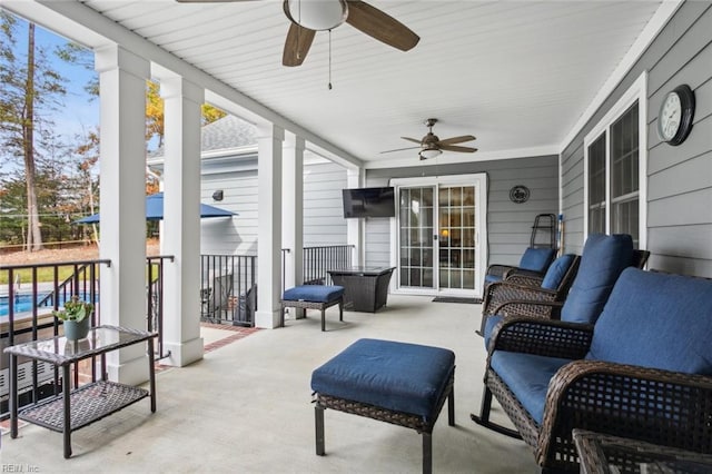 sunroom featuring ceiling fan