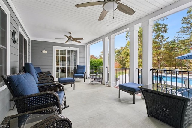 sunroom / solarium with ceiling fan