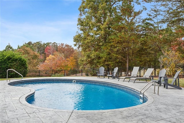 view of pool featuring a patio