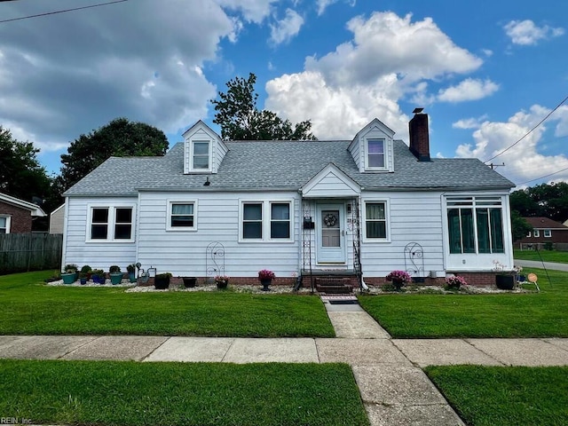 cape cod-style house featuring a front lawn