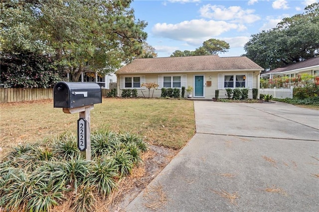 ranch-style house with a front lawn