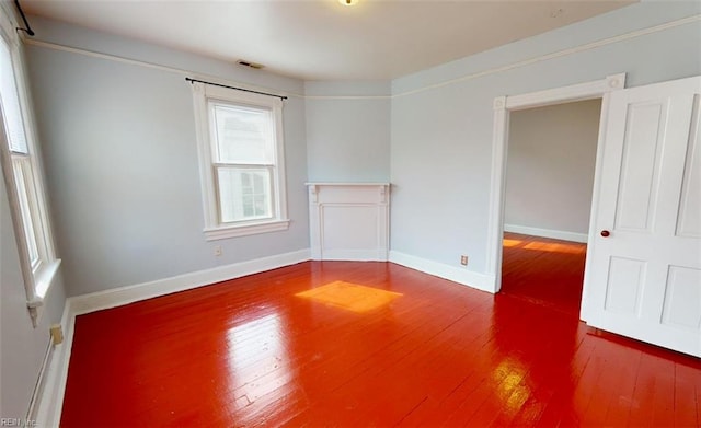 spare room featuring hardwood / wood-style flooring