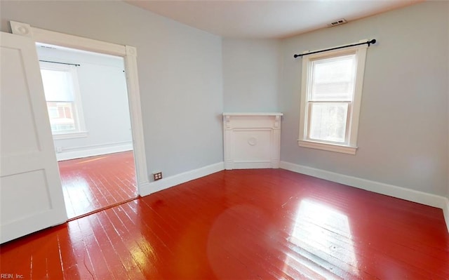 empty room with hardwood / wood-style floors