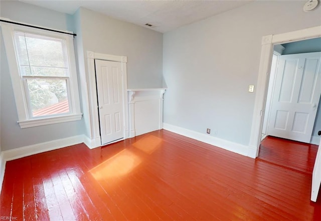 empty room featuring wood-type flooring