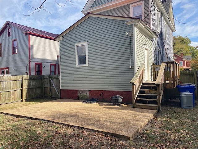 rear view of house featuring a patio