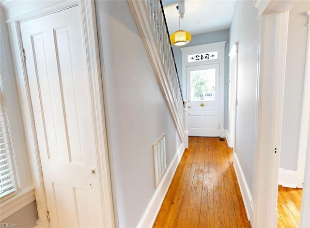 hallway featuring wood-type flooring