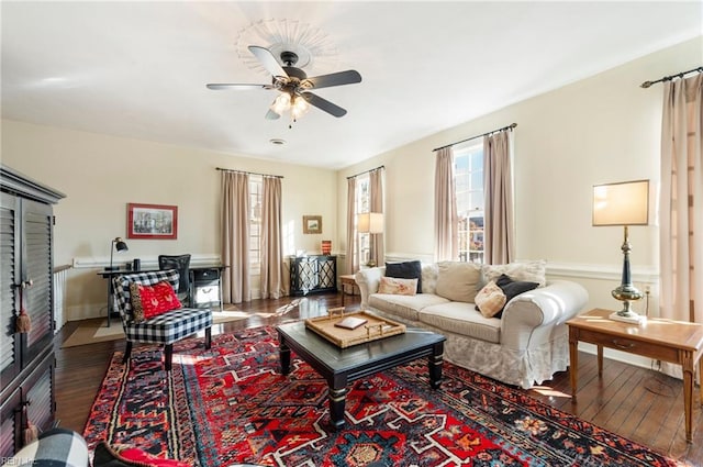 living room featuring hardwood / wood-style flooring and ceiling fan