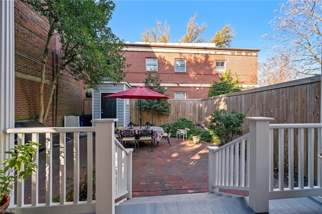 wooden terrace featuring a patio