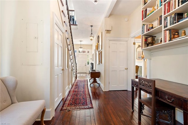 corridor featuring electric panel and dark hardwood / wood-style flooring